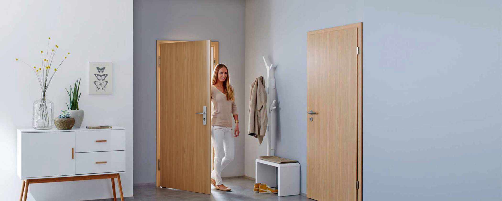 interior shot of woman walking through internal door
